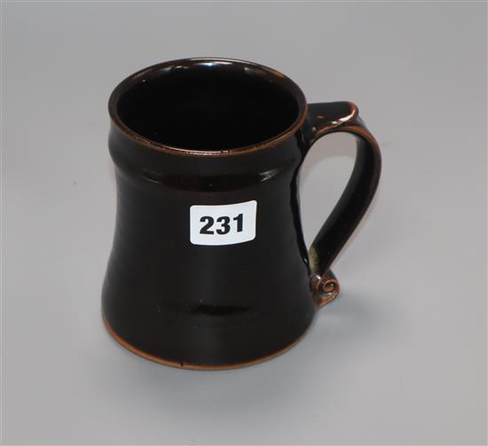 A Leach studio St Ives black glazed tankard H.12cm